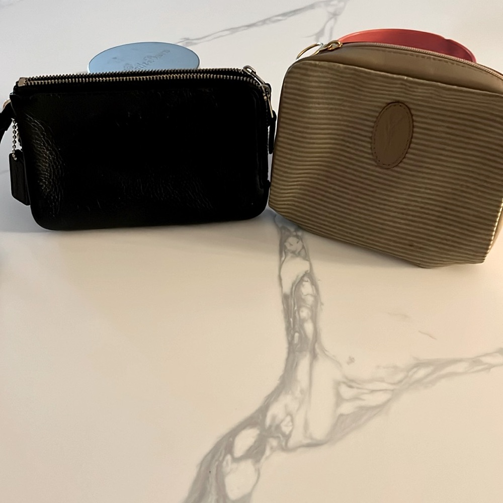 Winner’s Choice ((Coach Wristlet or YSL pouch)